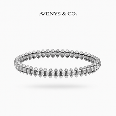 AVENYS & CO. Rivet Bangle on White Gold, 17cm, with a plain studded metal pattern and no stones.
