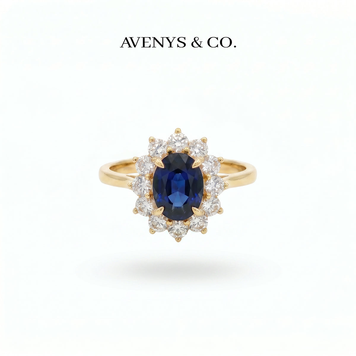 Classic Halo Ring with Blue Oval Stone – on Yellow Gold