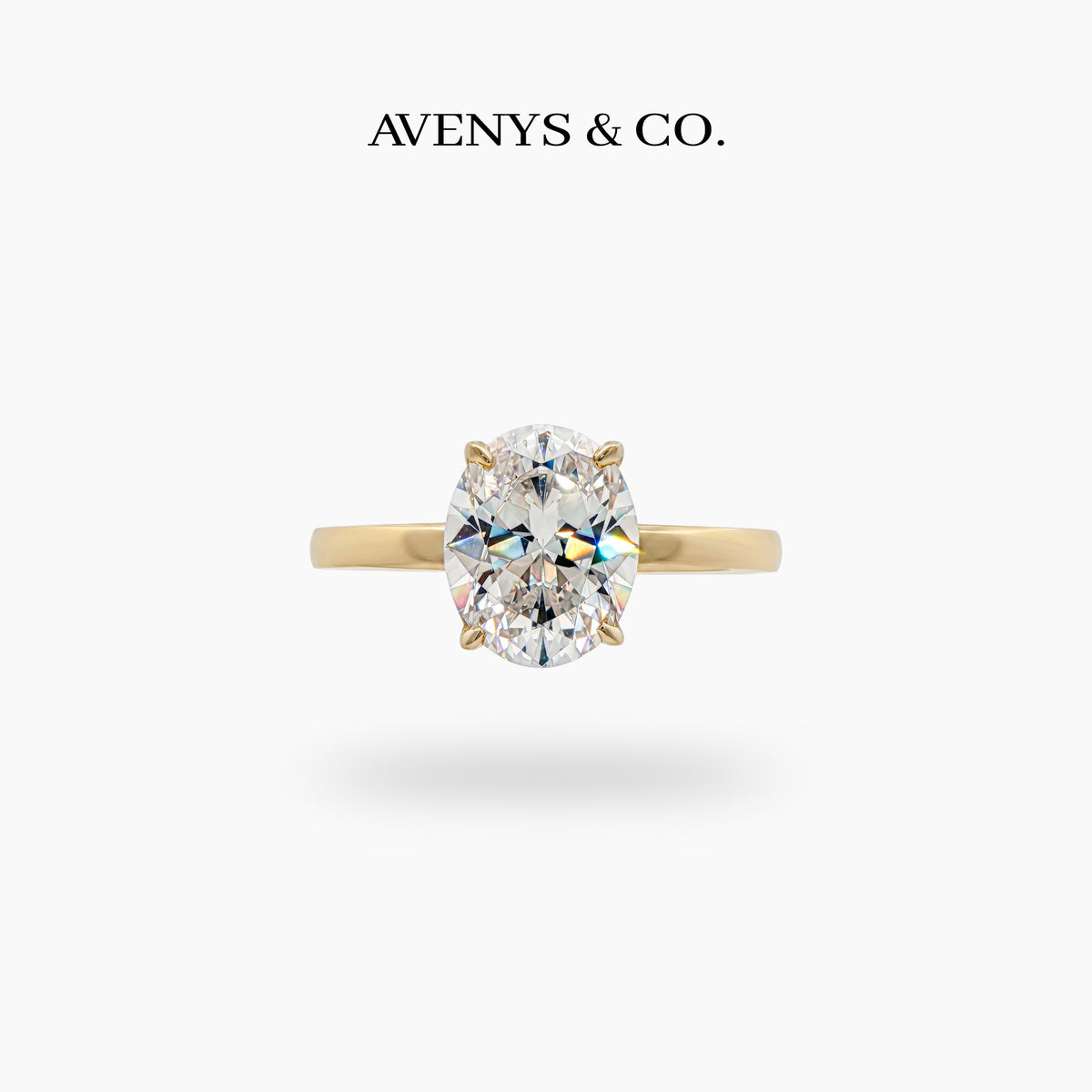 Oval Solitaire Ring with White Oval Stone – on Yellow Gold