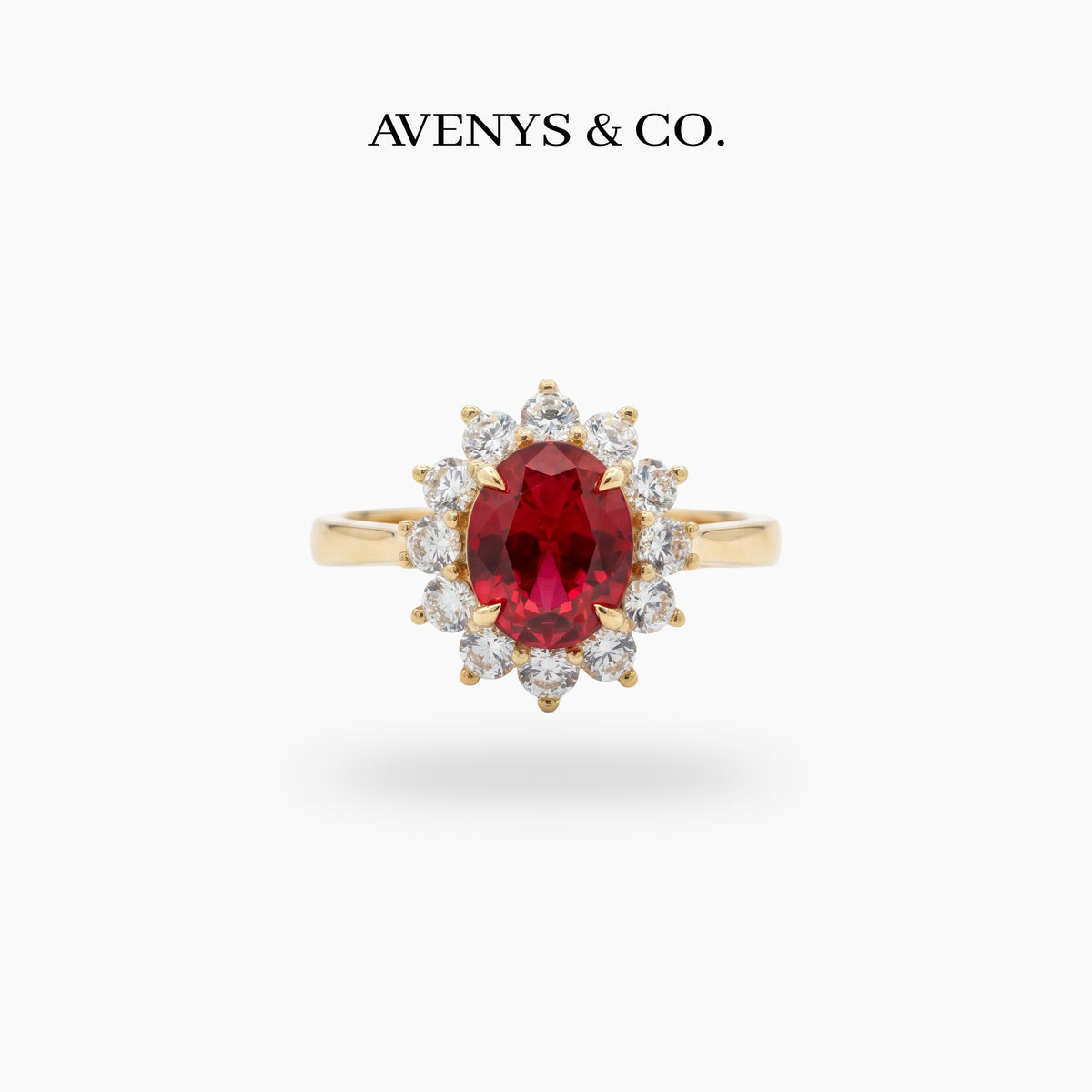 Classic Halo Ring with Red Oval Stone – on Yellow Gold