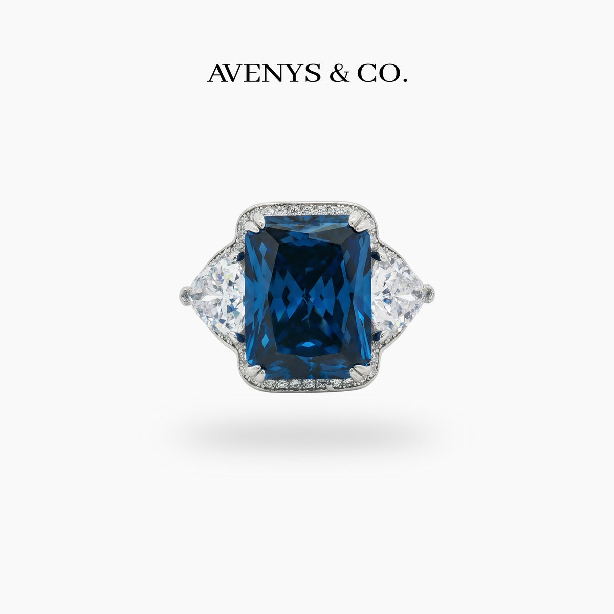 Queens Radiant Ring with Blue Round Stone – on White Gold