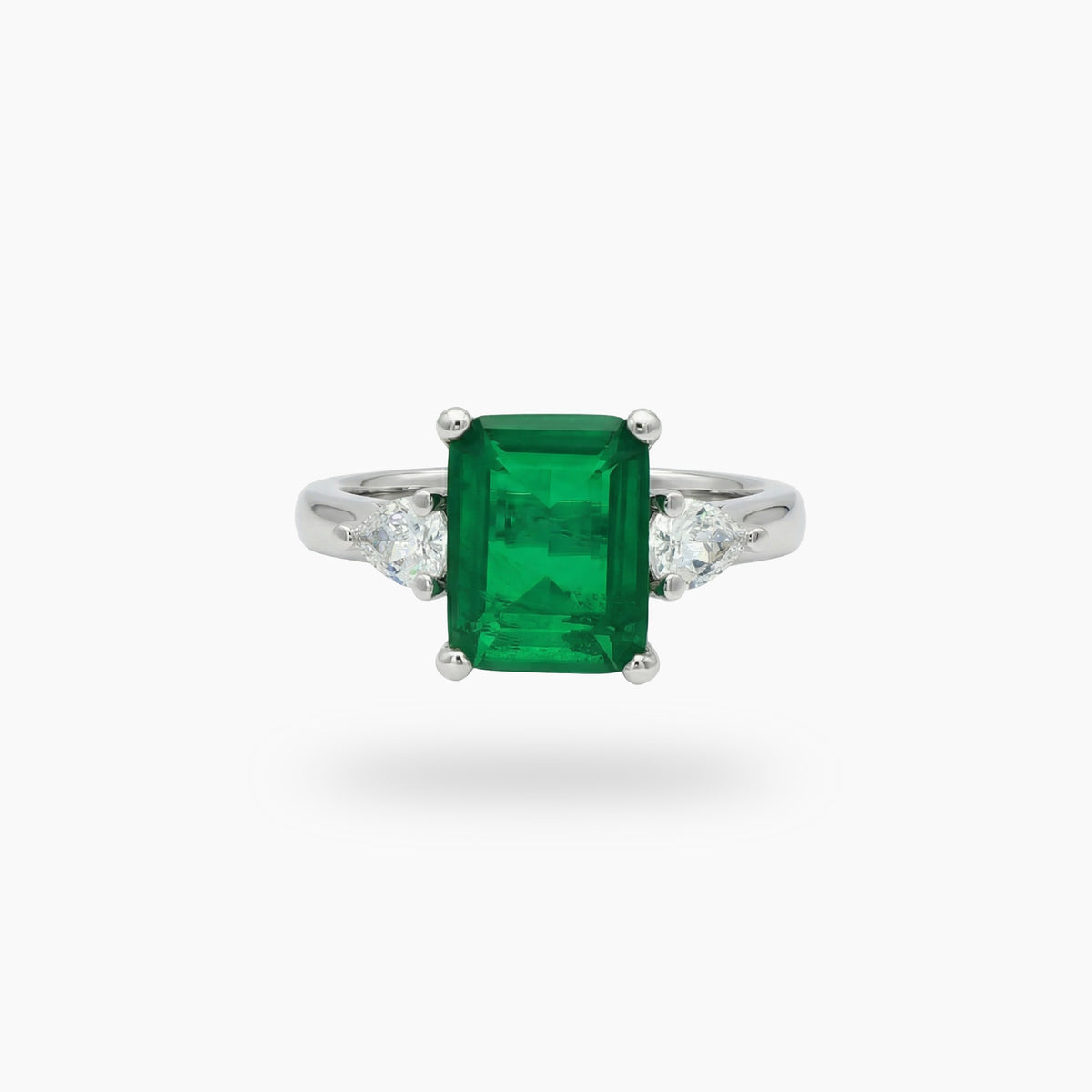 Emerald Pear Trilogy Ring with Green Emerald Stone – on White Gold