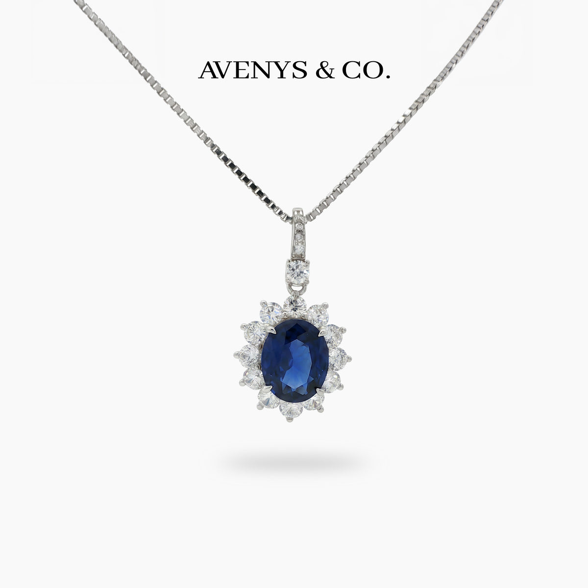 Classic Halo Necklace with Blue Oval Stone – on White Gold