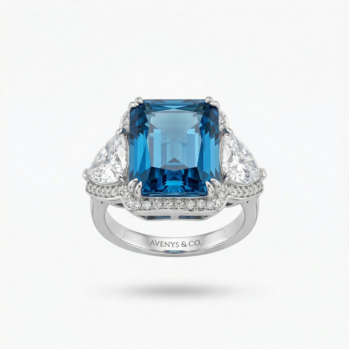 Queens Radiant Ring with Blue Round Stone – on White Gold