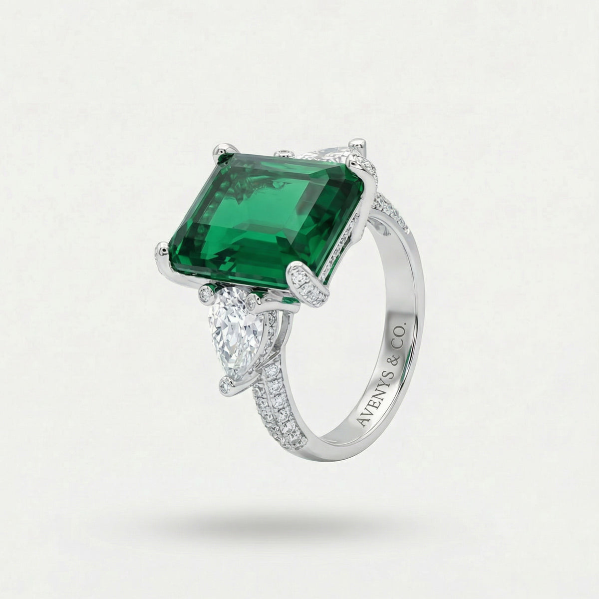 Emerald Pear Trilogy Ring with Green Emerald Stone – on White Gold