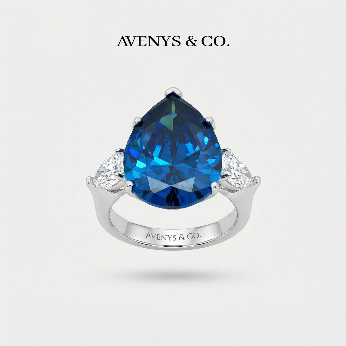 Pear Trilogy Ring with Blue Pear Stone – on White Gold