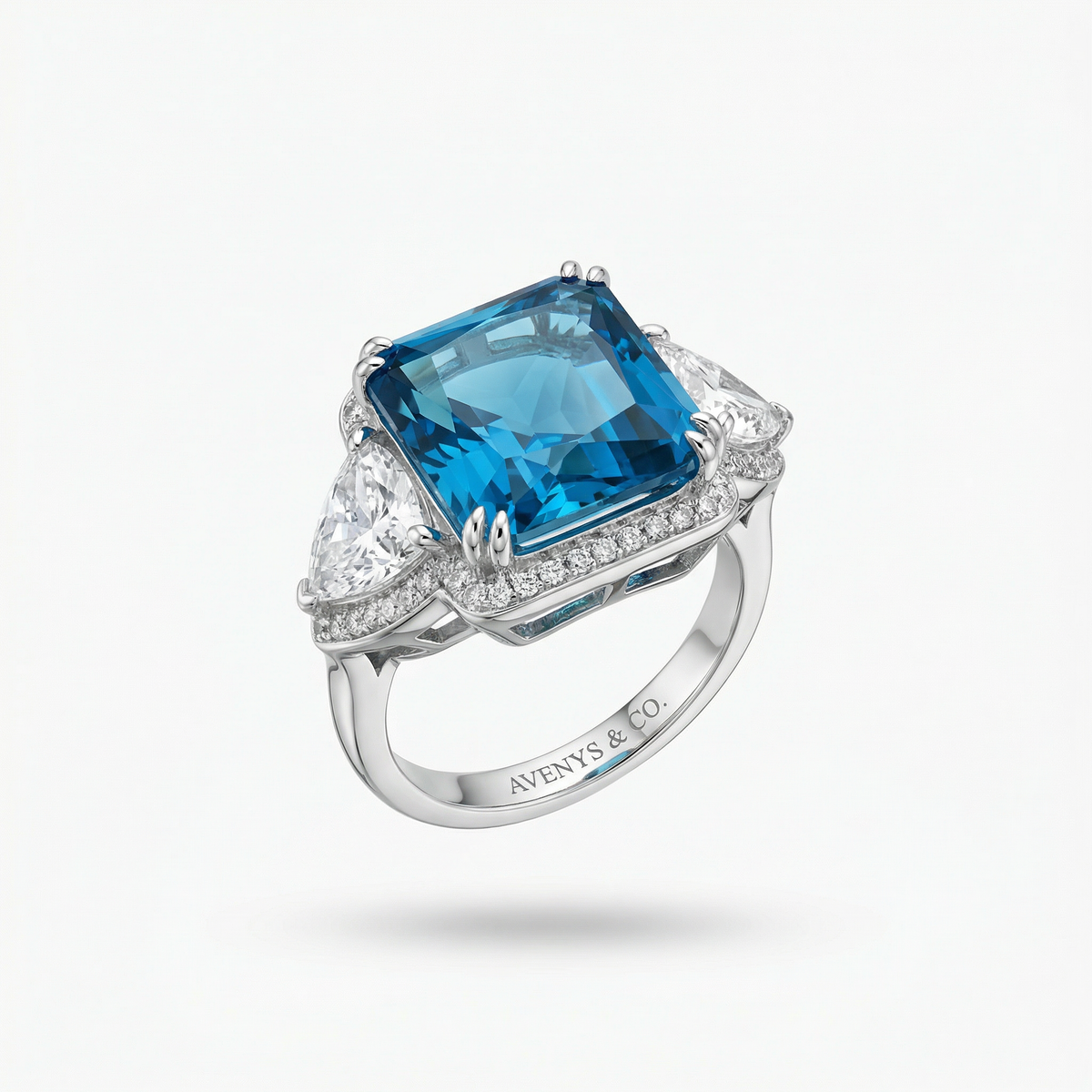 Queens Radiant Ring with Blue Round Stone – on White Gold