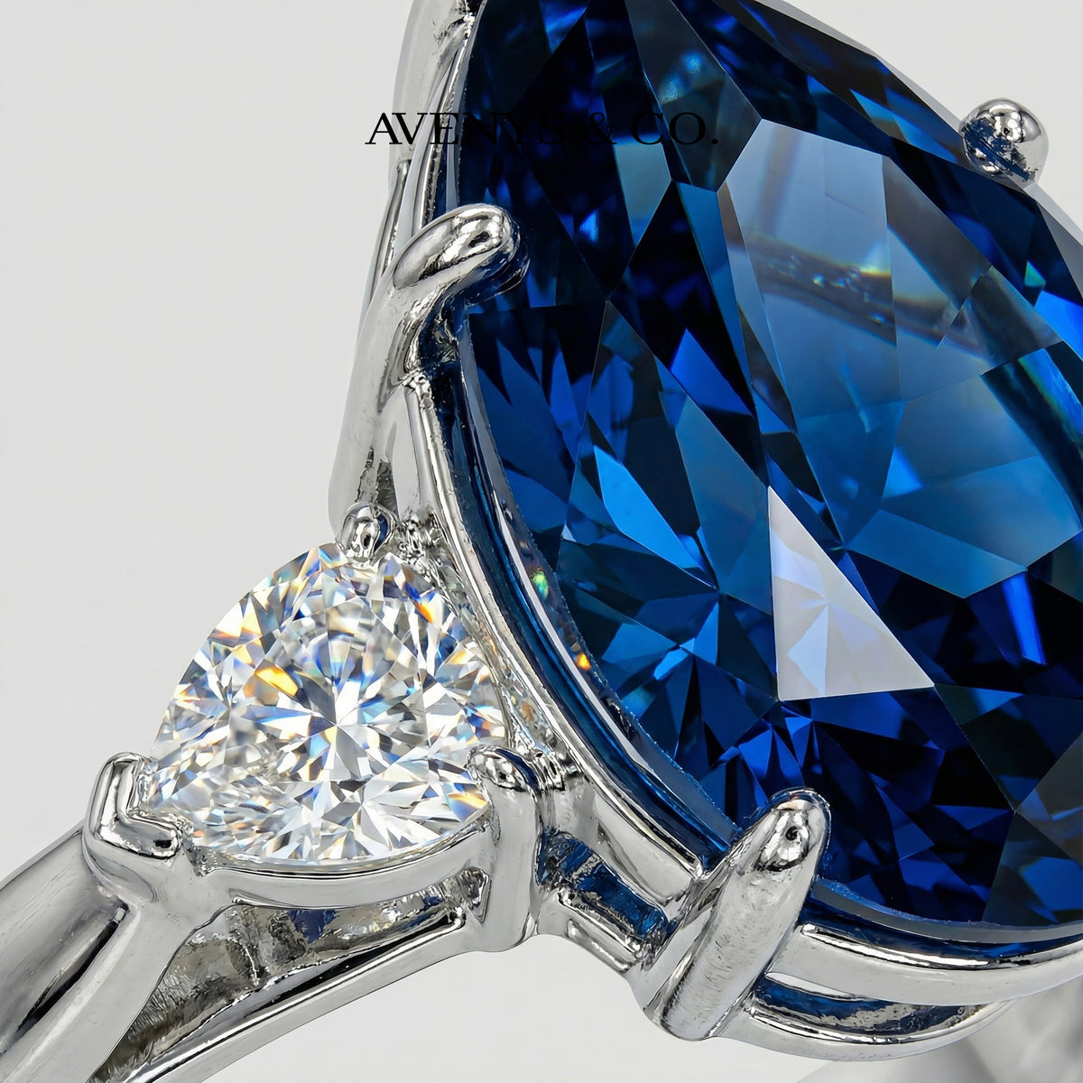 Pear Trilogy Ring with Blue Pear Stone – on White Gold