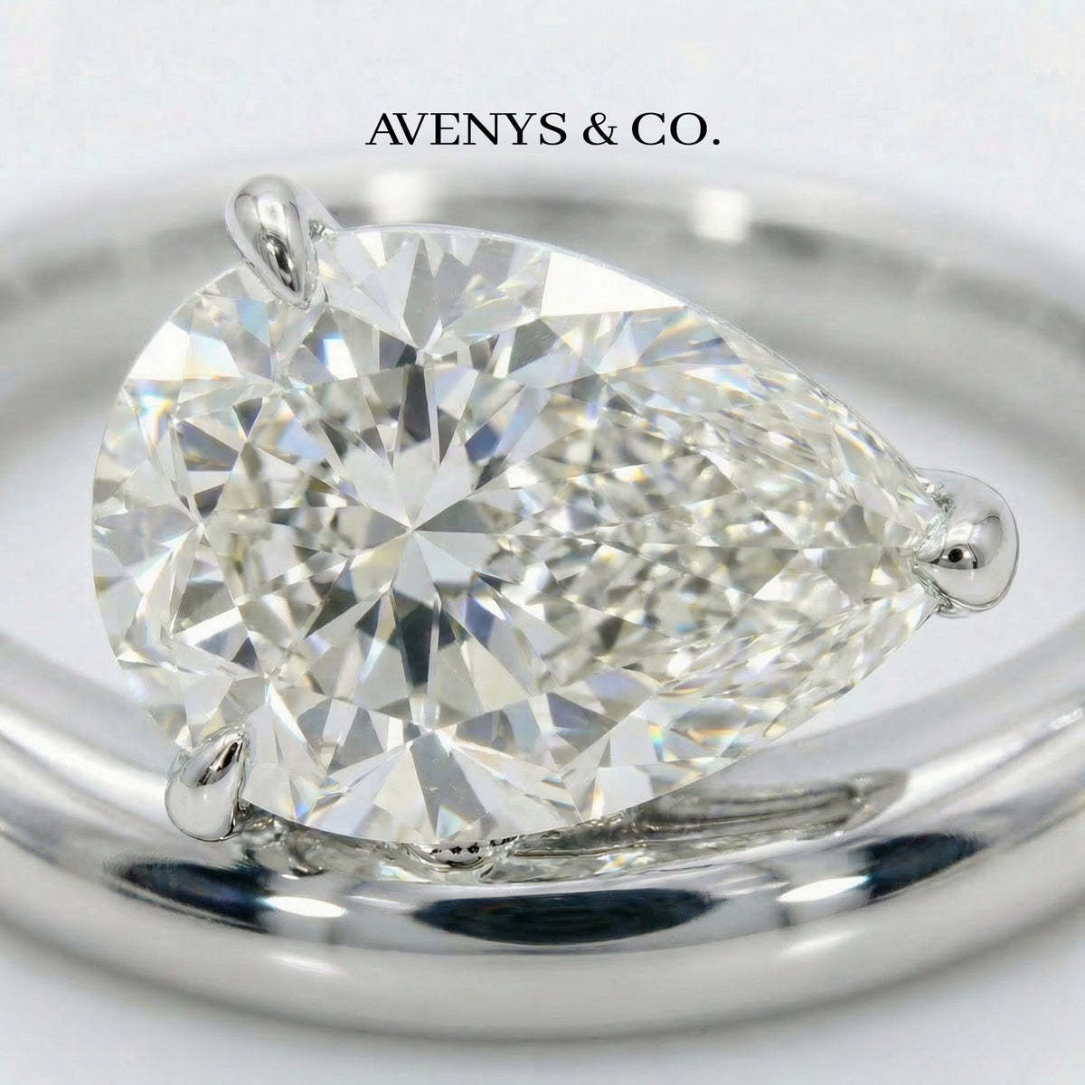Wave Solitaire Ring with White Pear Stone – on White Gold