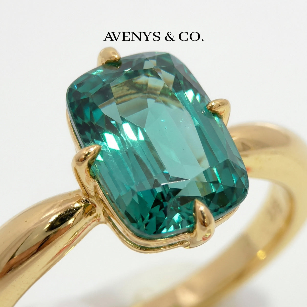 Modern Solitaire Cocktail Ring with Blue Cushion Stone – on Yellow Gold