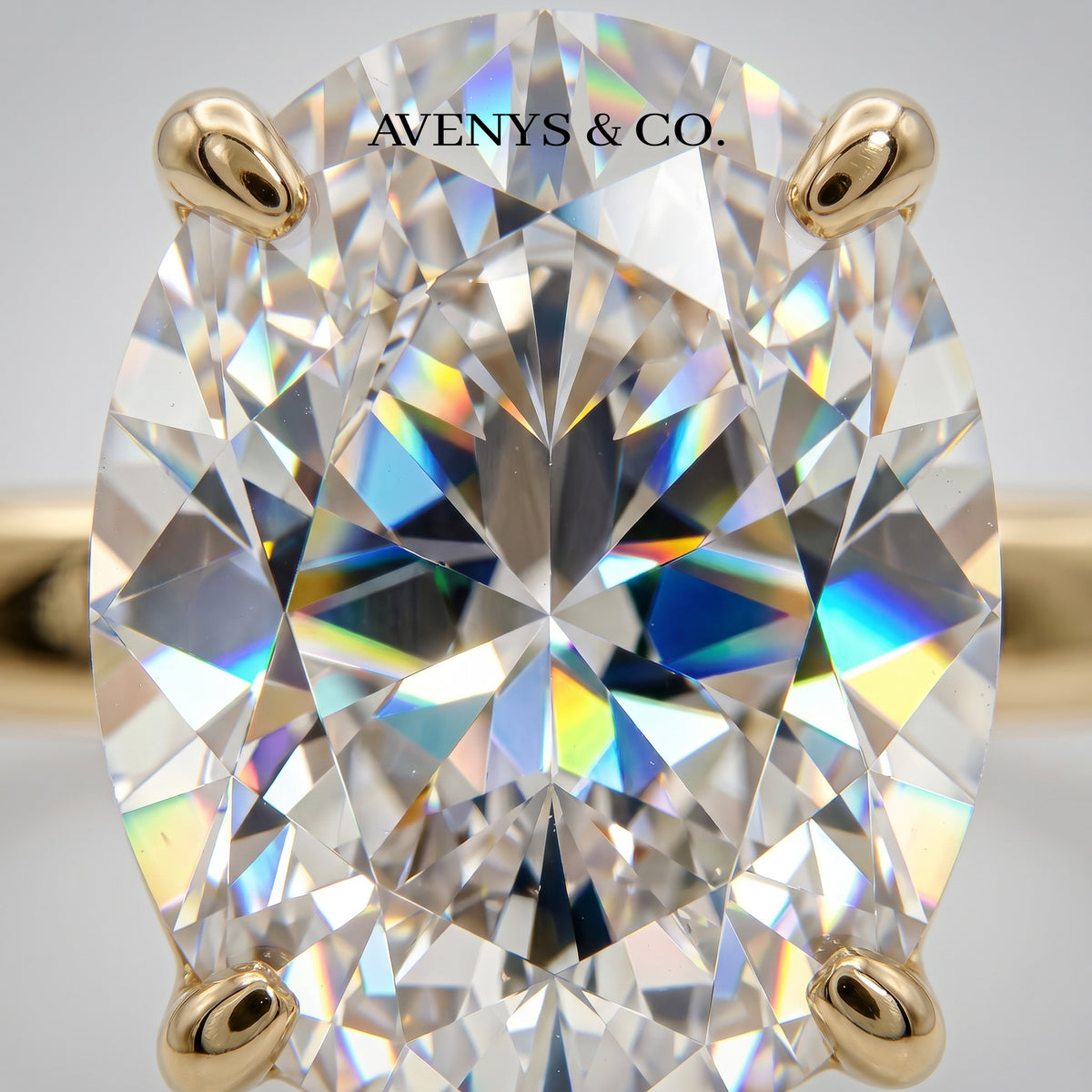 Oval Solitaire Ring with White Oval Stone – on Yellow Gold