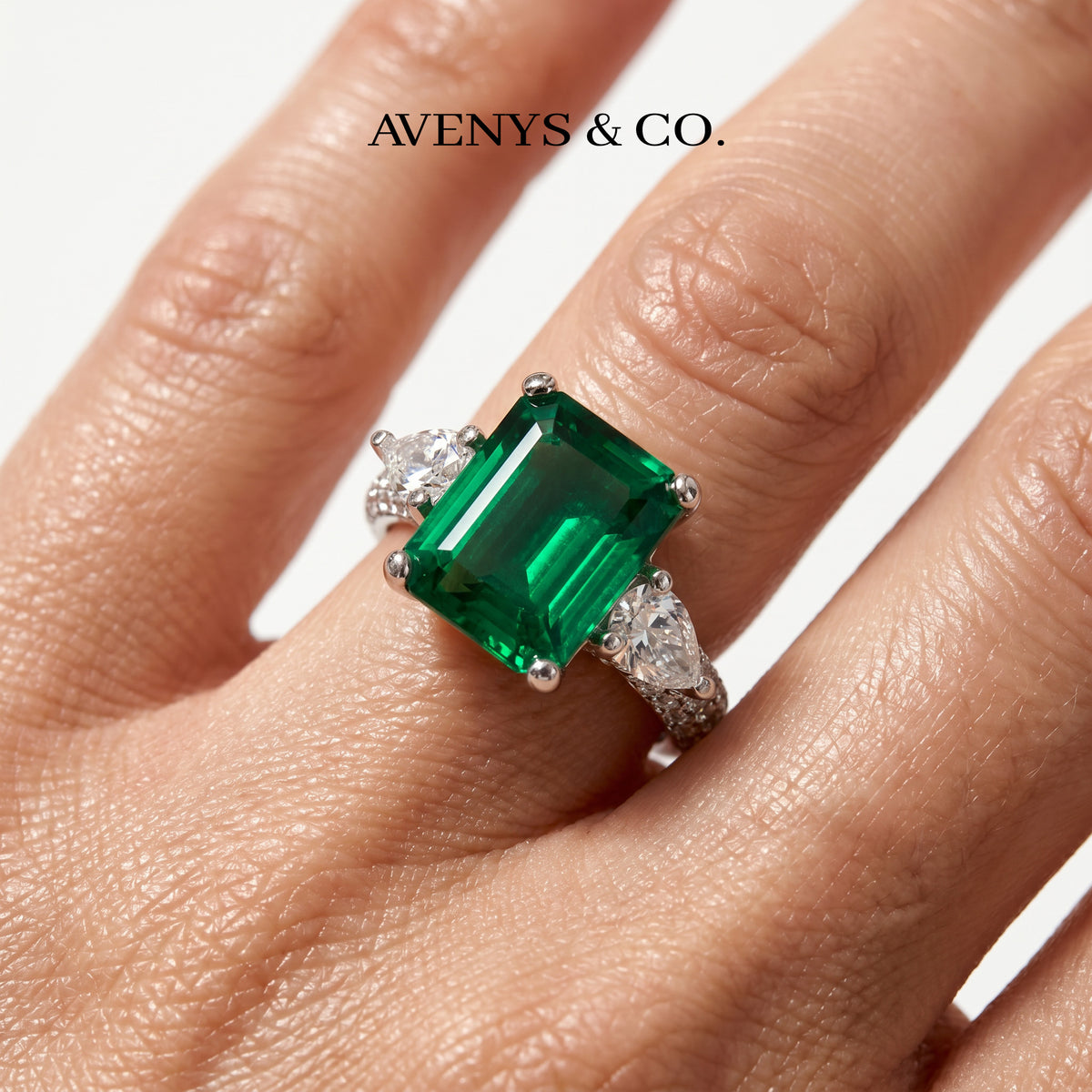 Emerald Pear Trilogy Ring with Green Emerald Stone – on White Gold