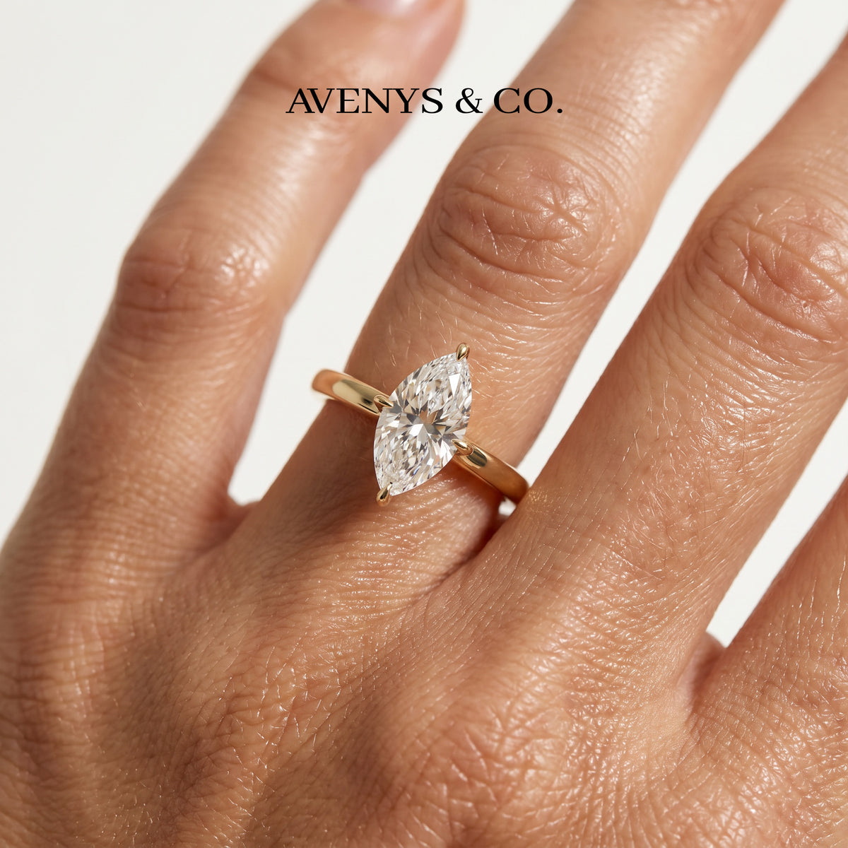 Marquis Solitaire Ring with White Marquise Stone – on Yellow Gold