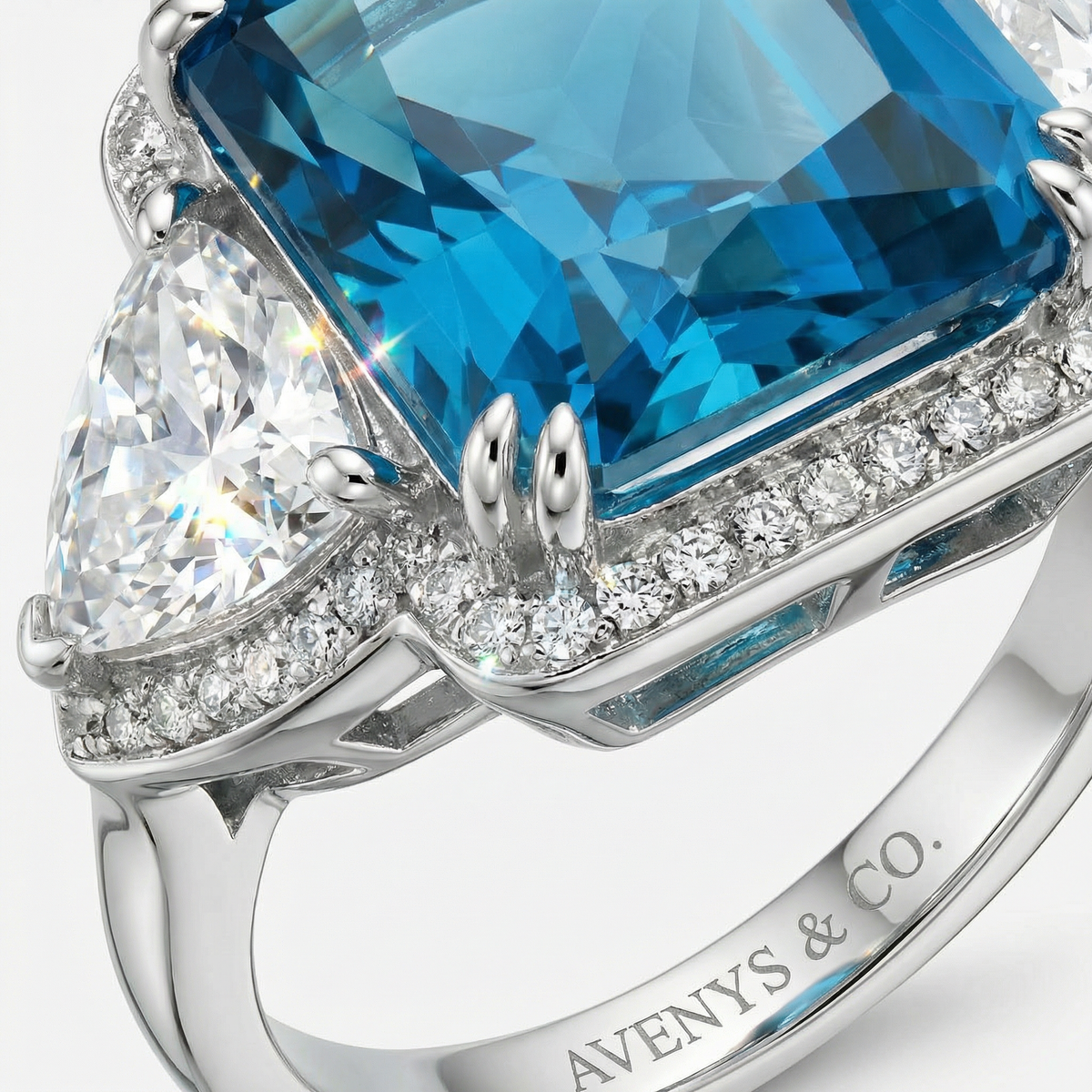 Queens Radiant Ring with Blue Round Stone – on White Gold