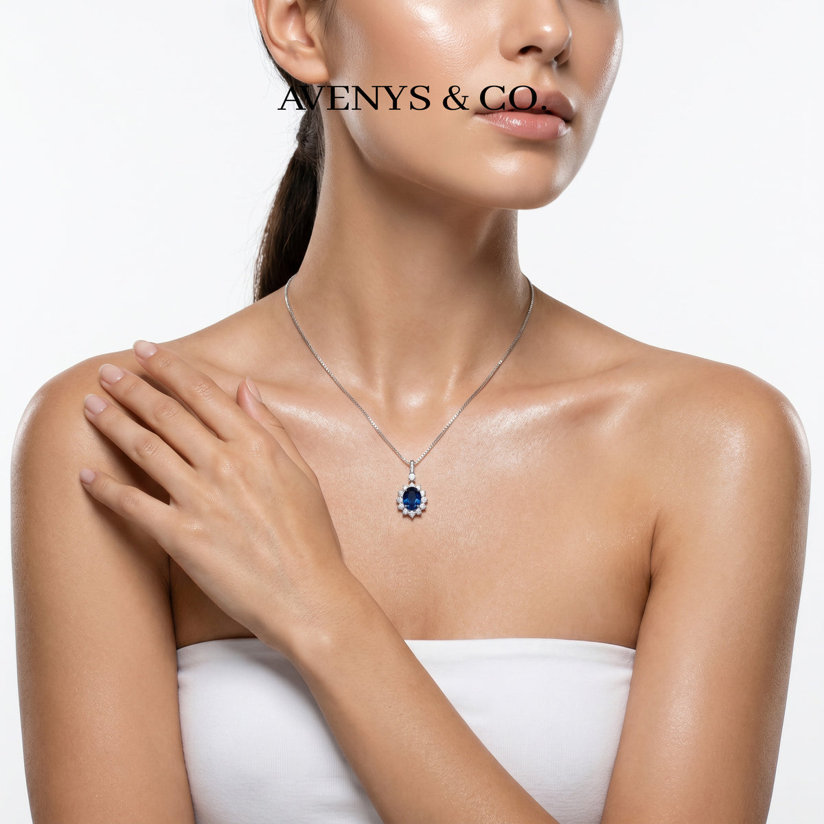 Classic Halo Necklace with Blue Oval Stone – on White Gold