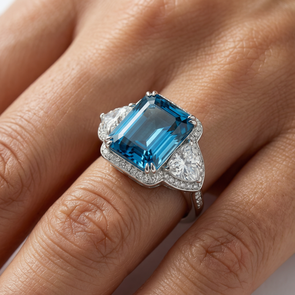 Queens Radiant Ring with Blue Round Stone – on White Gold