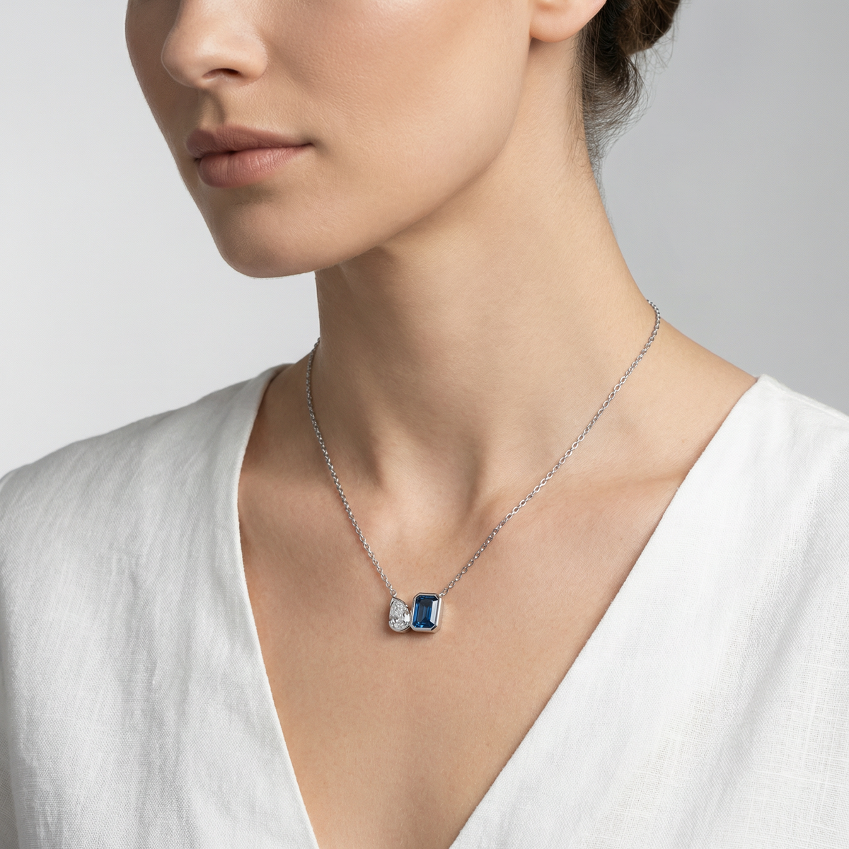Duality Necklace with Blue Emerald Stone – on White Gold