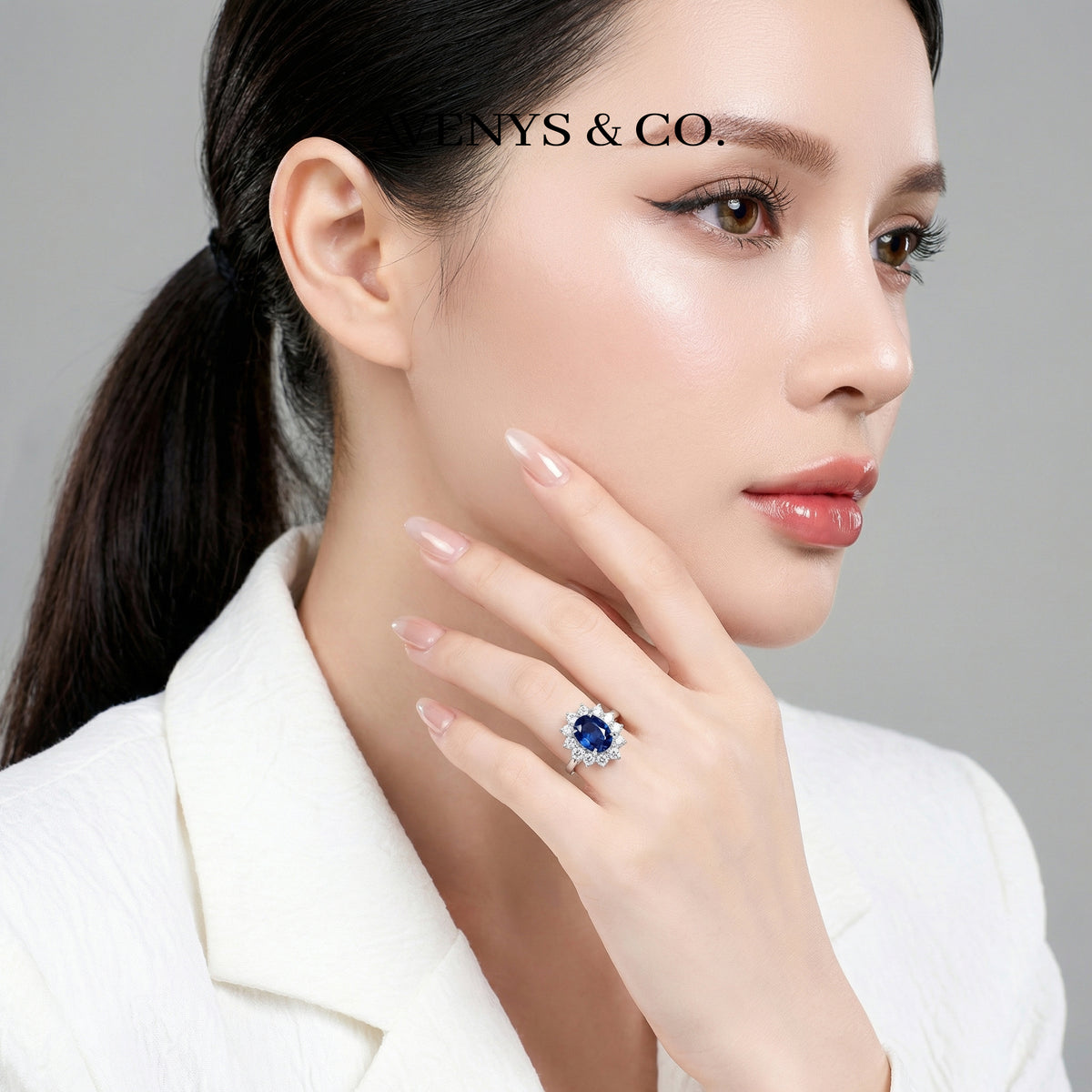 Classic Halo Ring with Blue Oval Stone – on White Gold