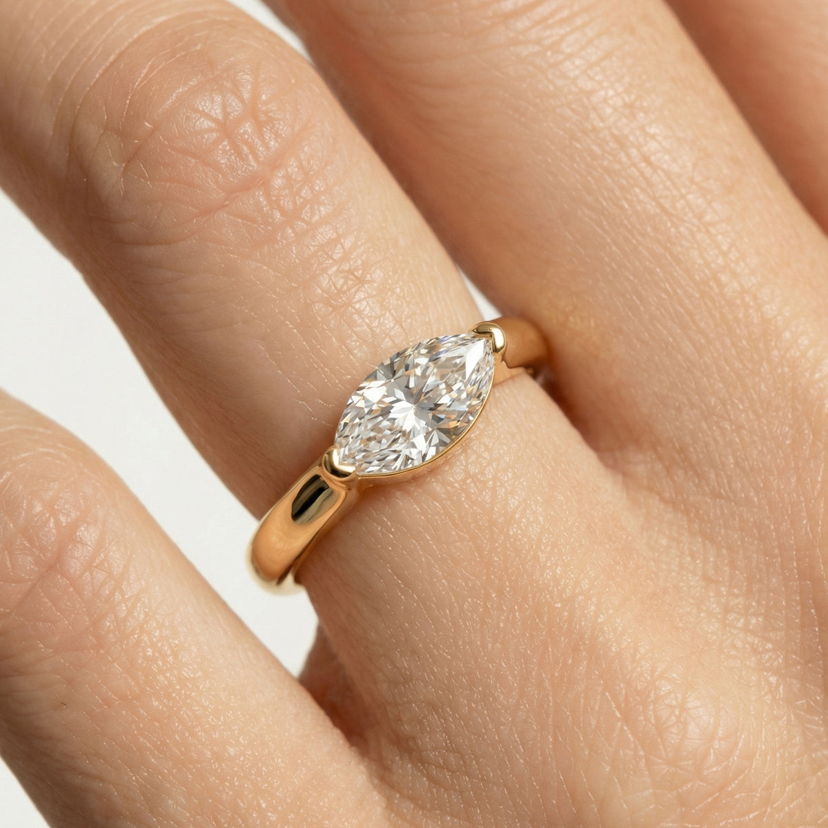 Delicate Bezel Ring with White Marquise Stone – on Yellow Gold