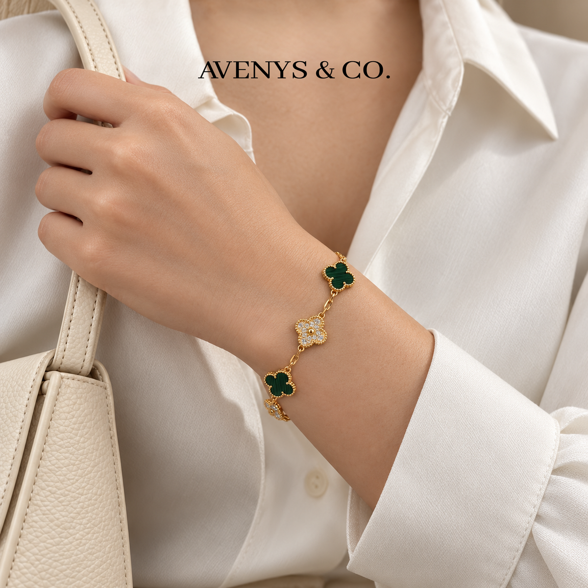 Green malachite bracelet styled with an ivory blouse