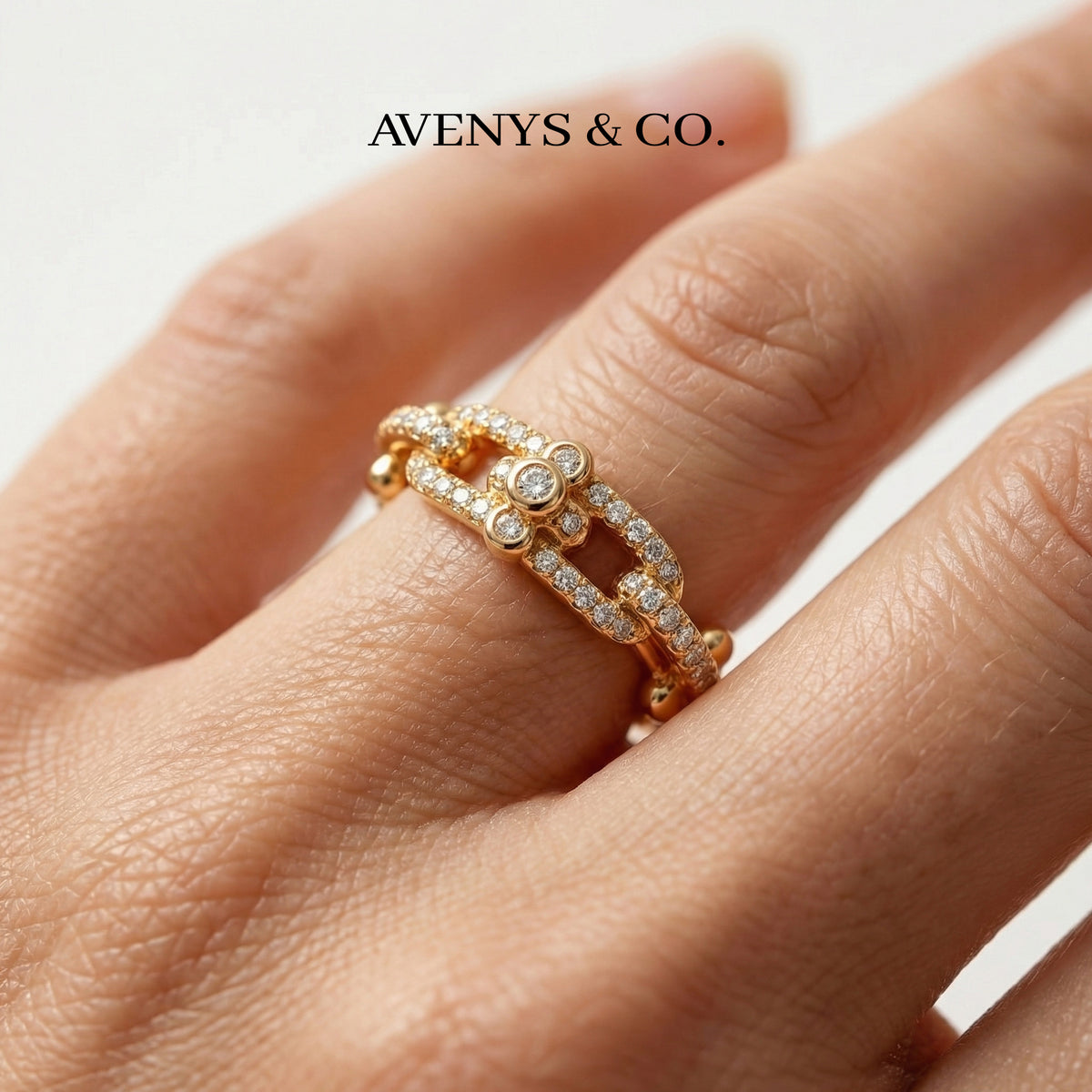 Interlock Pave Ring with White Round Stone – on Yellow Gold